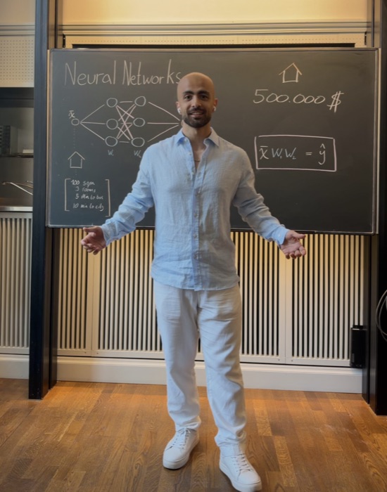 Majd Jamal explaining a neural network at a blackboard